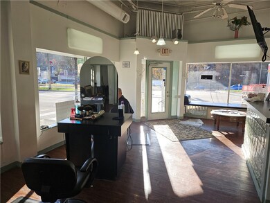 Front area has partner cutting desks opposite eachother.