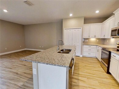 This Photo is a representation of the kitchen layout. The colors and finishes vary.