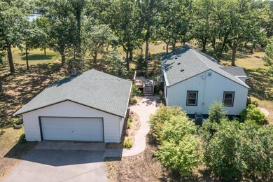 Easy access off of Hwy 371 between Brainerd & Little Falls....that is Crow Wing Lake in the background.  Lots of easy care landscaping has already been installed.