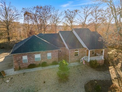 All brick home with oversized three car garage.  Home has been connected to Sewer and has a brand new roof.  Many updates inside.