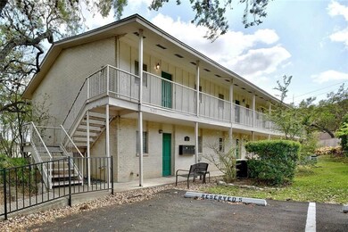 View of building exterior with stairway and uncov