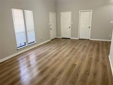 Unfurnished room featuring light wood-style floors and healthy amount of natural light