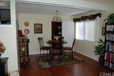 Dining room has laminate floors. Note the 6 panel 