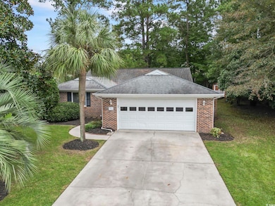 View of front of property with a garage and a fron