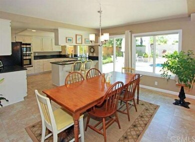 The breakfast nook is 15.8 by 11 feet and flows di