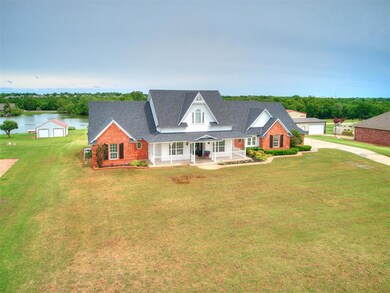 New england style home with a garage, a water view