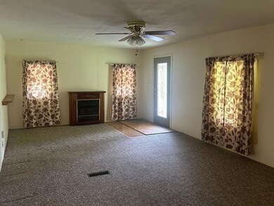 Unfurnished living room with visible vents, a ceil