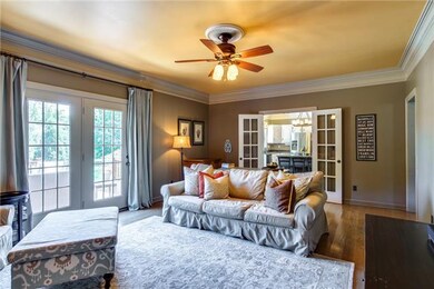 Living room exits to the kitchen with french doors