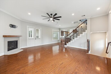 This spacious living area features hardwood floors