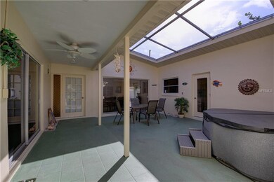 Interior courtyard of home features a hot tub and 