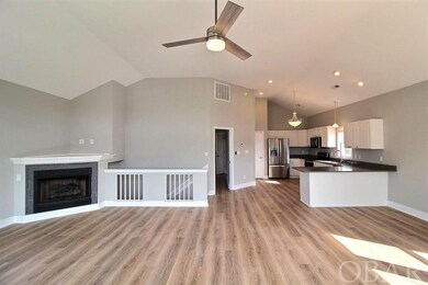 Grand Room with Gas Fireplace and Top Deck Access.
