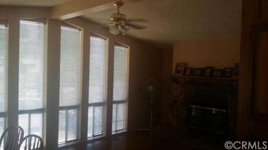 Living room with Fireplace overlooking driveway
