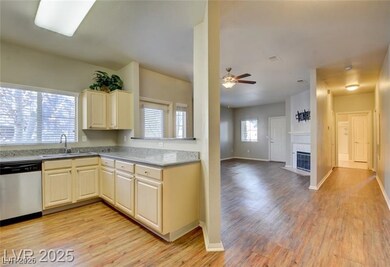 Kitchen featuring stainless steel dishwasher, ligh