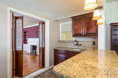Wet bar is between the living room and family room
