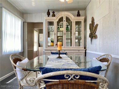 Dining space with carpet flooring, a healthy
amou