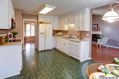 Updated kitchen boasts new cabinet hardware and plenty of cabinet space. Don't have a refrigerator?  Don't worry, because this one stays!