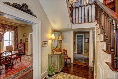 Foyer leading to wide hallway, dining room, parlor
