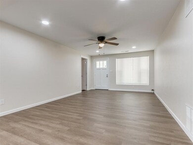 Empty room with ceiling fan and hardwood / wood-st