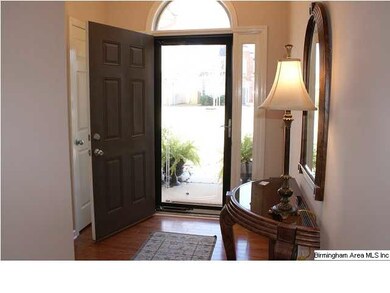 Foyer with glass storm door