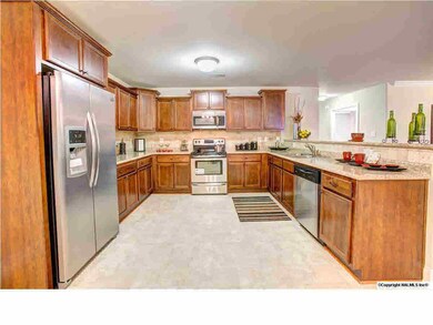 Large open kitchen with stainless steel appliances