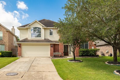 A spacious two-car garage complements the home’s c