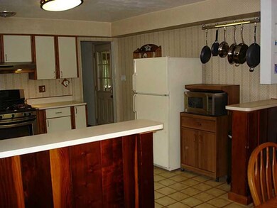 Kitchen. You could easily add a movable island the