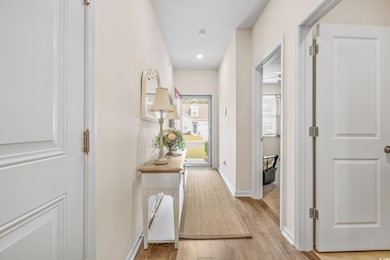 Hall featuring light hardwood / wood-style floorin