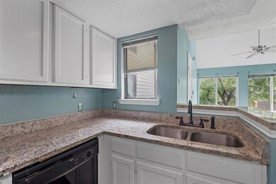 Kitchen features granite counters