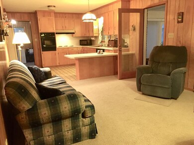 Den with door to sunroom