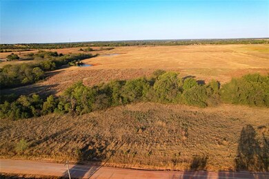 Birds eye view of property with a rural view