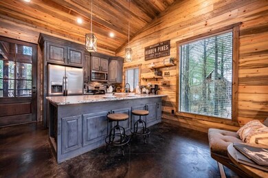 Kitchen featuring decorative light fixtures, a cen