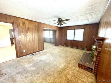 Family room featuring a ceiling fan and carpet flo