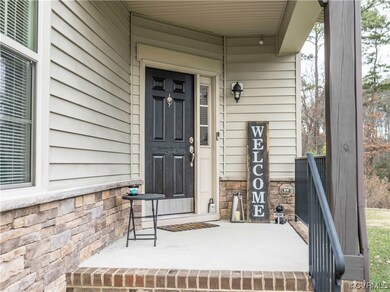 Entrance to property featuring a porch