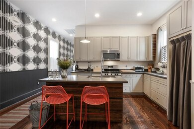Kitchen view leading to front entrance.