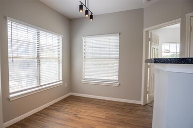Unfurnished dining area with wood finished floors
