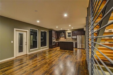 Open main level with open stairs, hardwood floors, 9' ceilings