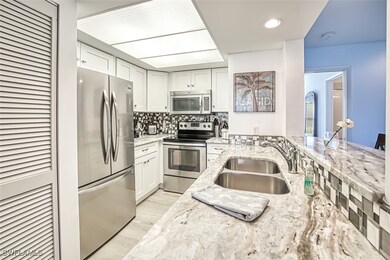 Kitchen featuring tasteful backsplash, appliances