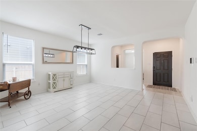 Entryway flowing into the well sized dining room