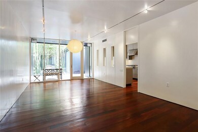 LIVING ROOM/ DINING ROOM OVERLOOKING FRONT AND BAC