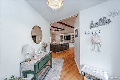 Hardwood floored foyer with natural light