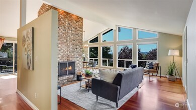 Vaulted ceilings with floor to ceiling brick fireplace.
