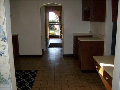 Kitchen. View from kitchen to front entrance