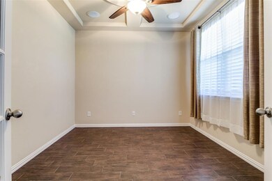 The study also features a tray ceiling, Bose sound