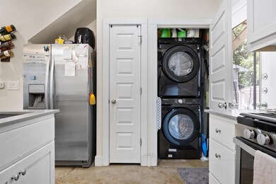 Laundry area featuring estacked washer and dryer
