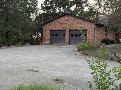 2 Car Garage with openers featuring driveway.