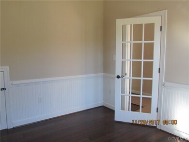 Office/Dining with hardwood floors and wainscottin