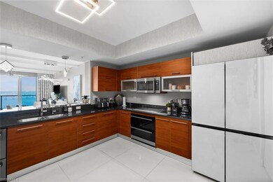Kitchen featuring light tile patterned floors, sto