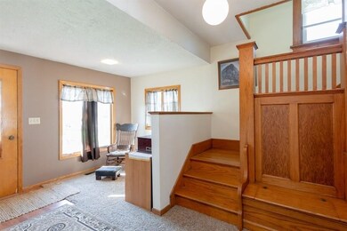 Front entry area, gorgeous oak staircase and built