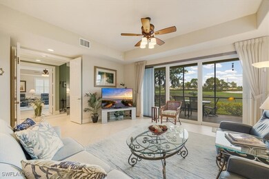 Living room with light tile patterned floors, visi