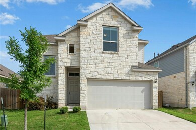 View of front of house featuring stone siding, dr